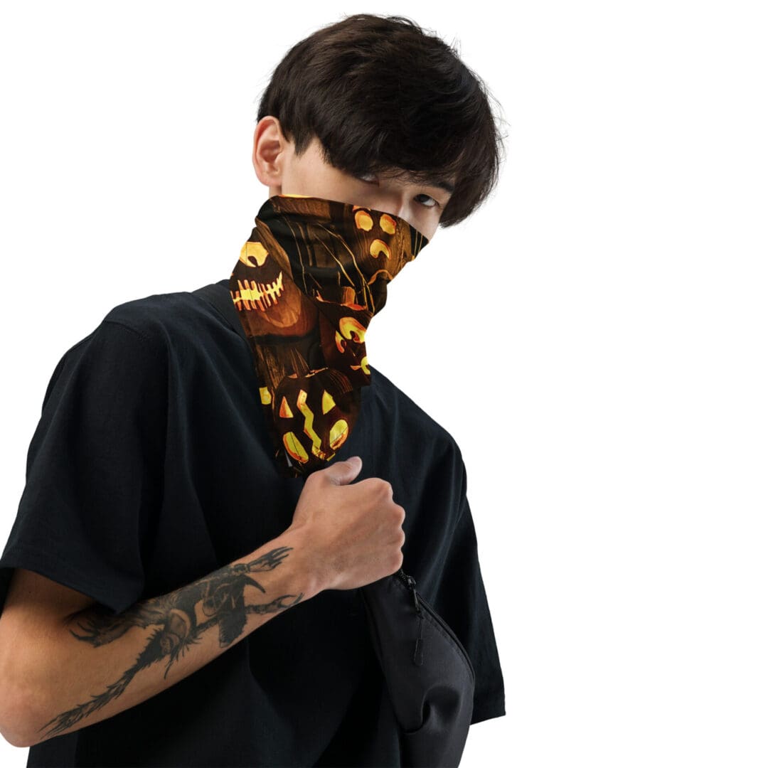 Person wearing Halloween-themed face covering, dark shirt.