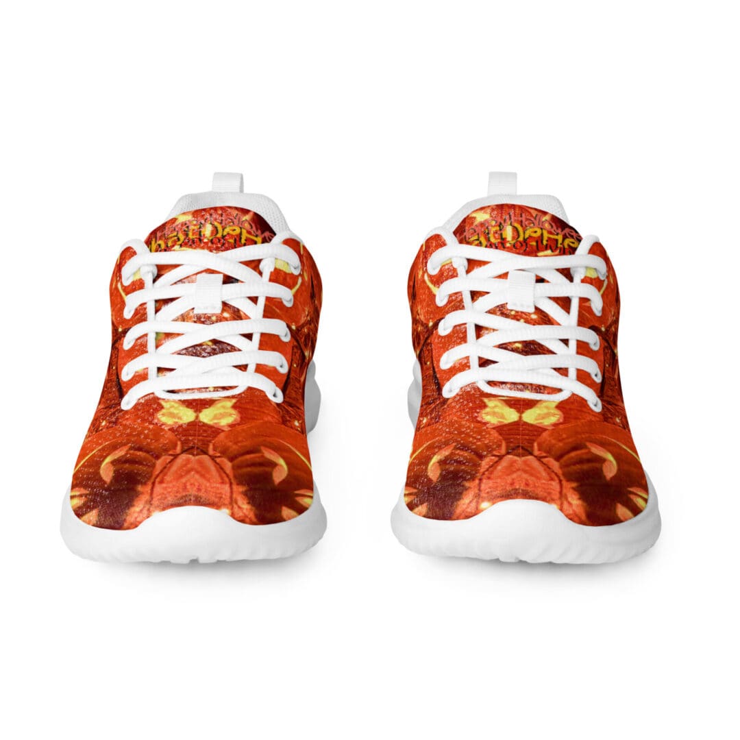 Orange sneakers with white laces, front view.