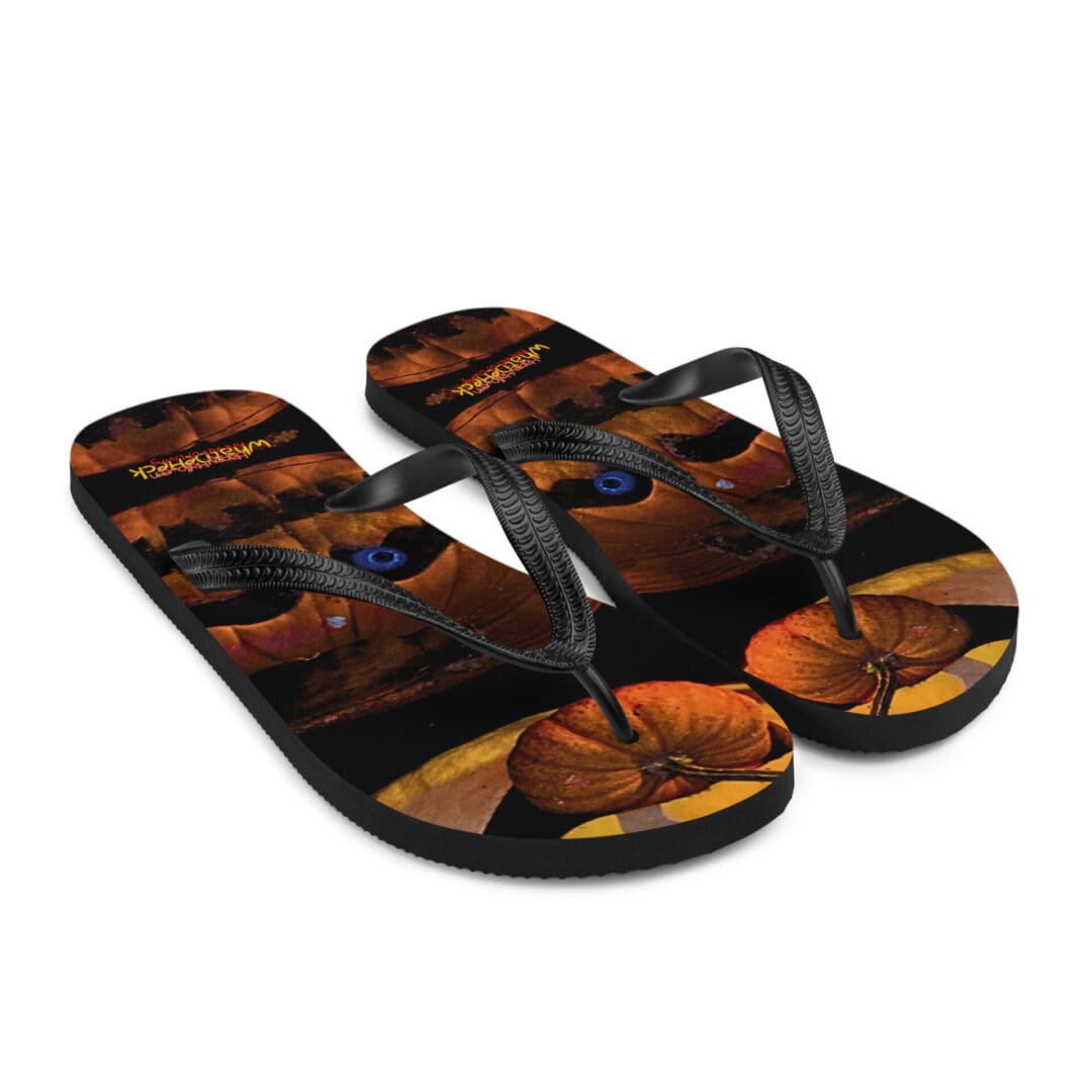 Flip-flops with orange pumpkin design.
