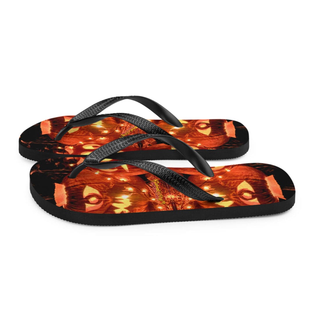 Flip-flops with fiery red abstract design.