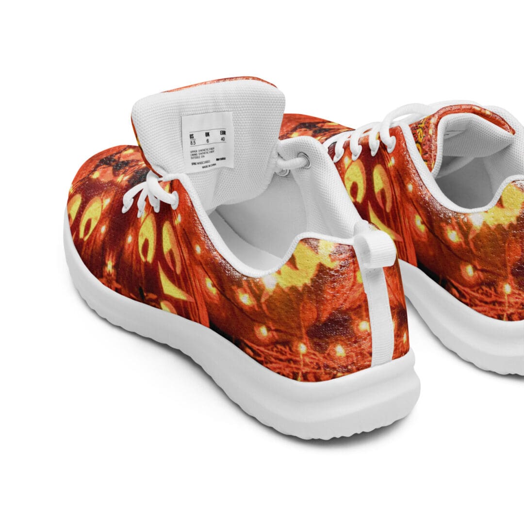 Halloween-themed sneakers with pumpkin design.